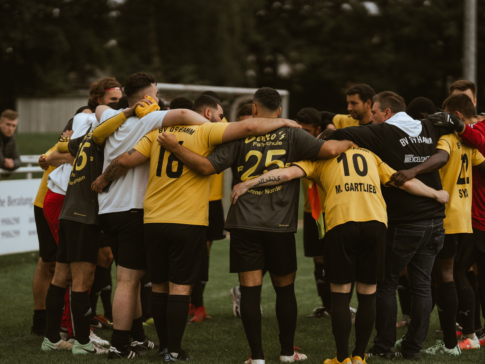 A team huddle on a sports pitch